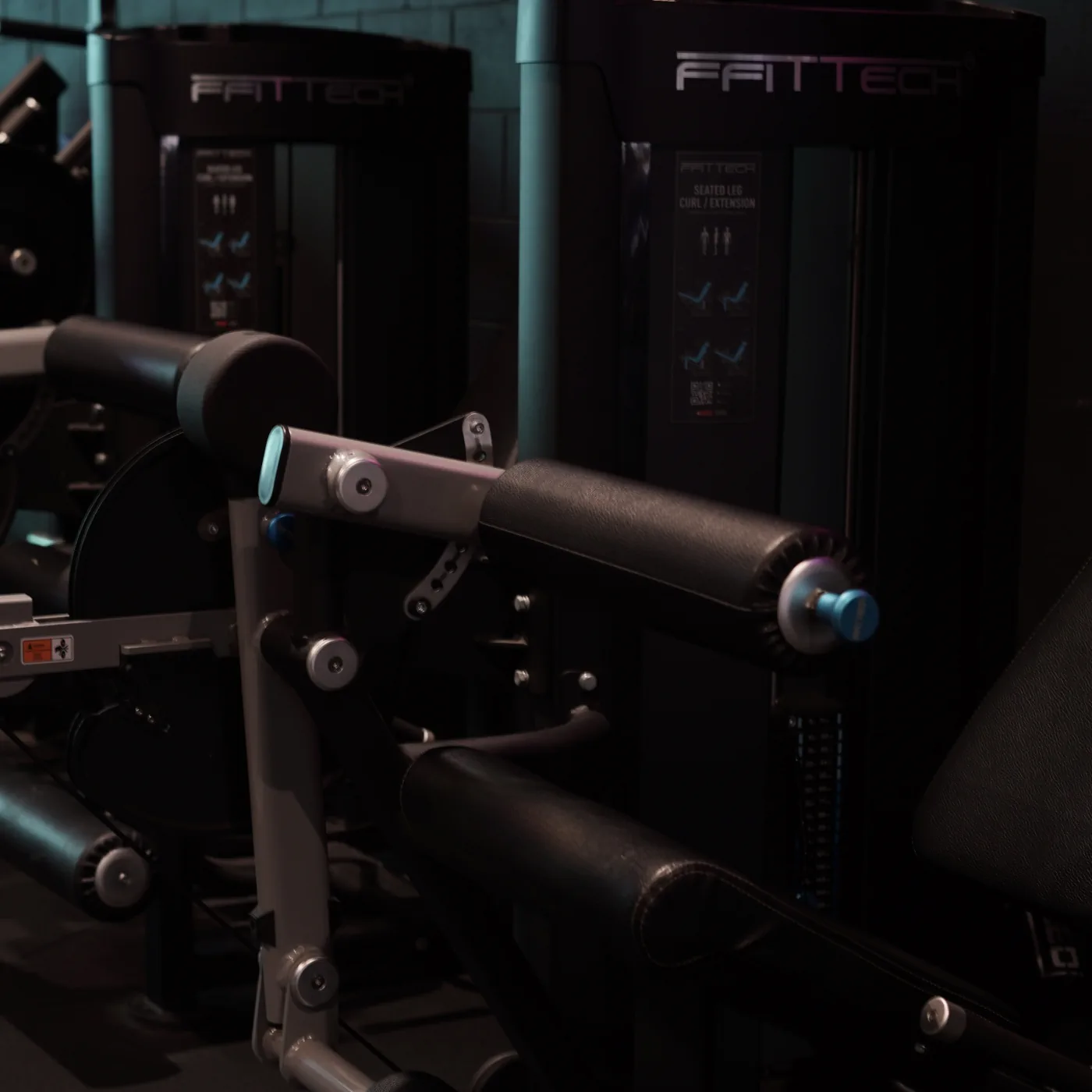 Sparc Up strength machines arranged under green lighting